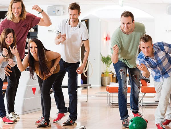 Young adults bowling