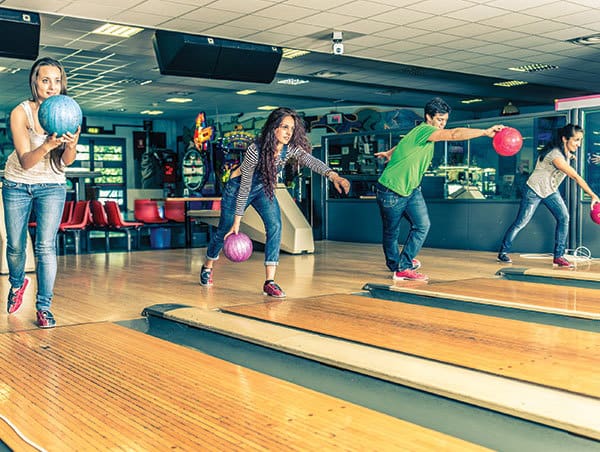 Young adults bowling